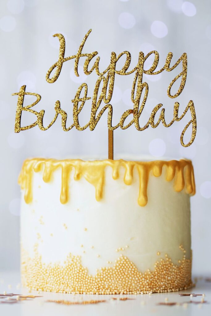 Elegant gold drip birthday cake for celebration at Martha's Bed and Breakfast in Lincoln, Nebraska